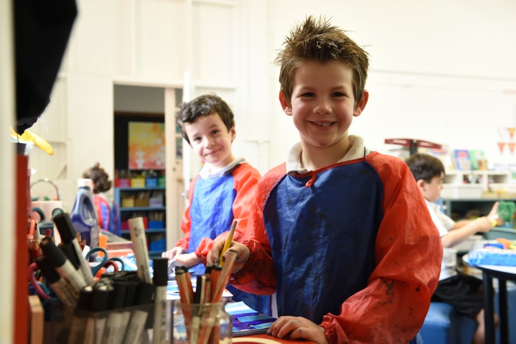 Students painting in the classroom