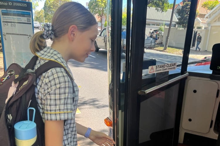 Student getting on a bus