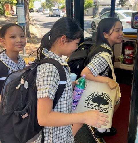 Students getting on a school bus