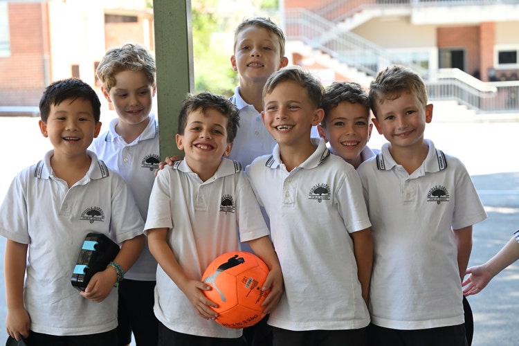 Boys posing with football