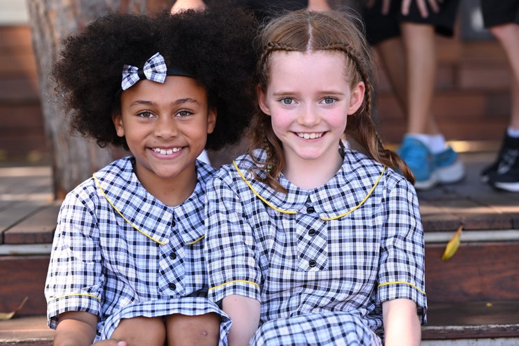 two students sitting on the deck